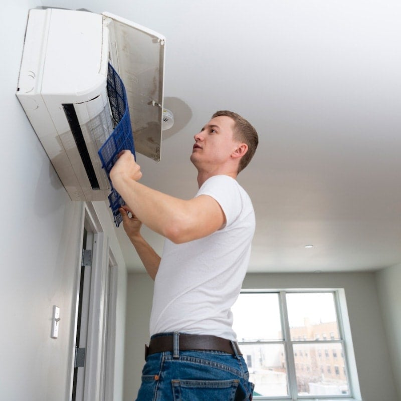 Man Replacing Filter|Man Replacing Filter
