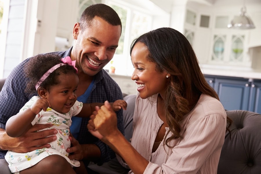 Happy young family in a comfortable home in Keizer