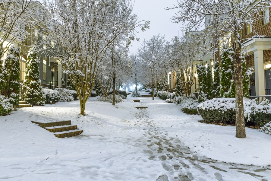 Typical townhouses on United State suburbs with a courtyard in the middle and no numbers showing on the houses on a typical winter wonderland setting, Prepping Your Pipes for Winter