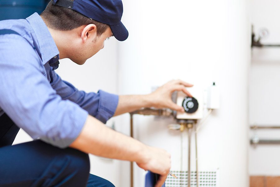 Technician check in a water heater in oregon