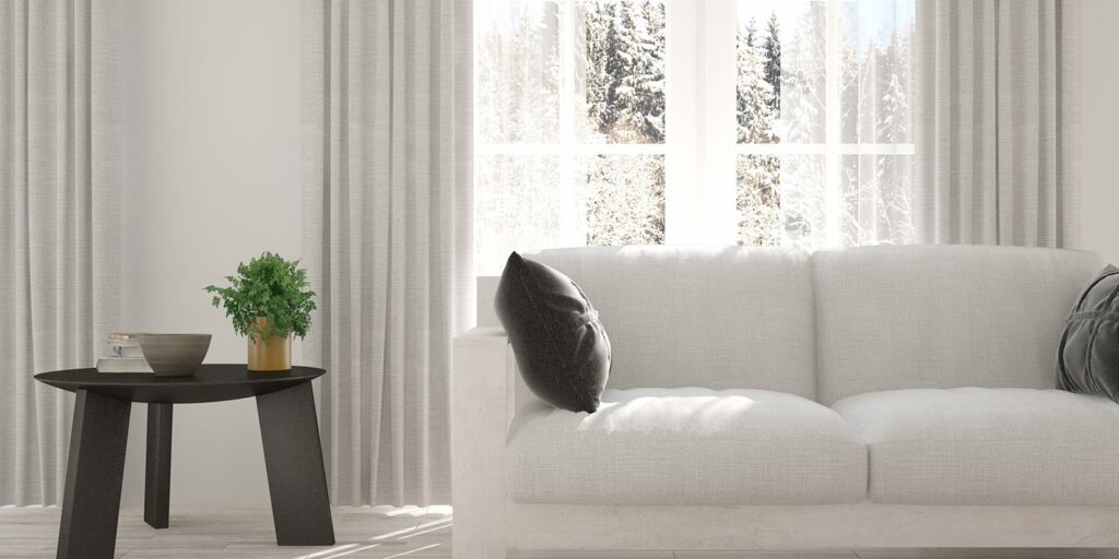 Living room with large window and white couch.|Living room with large window and white couch.